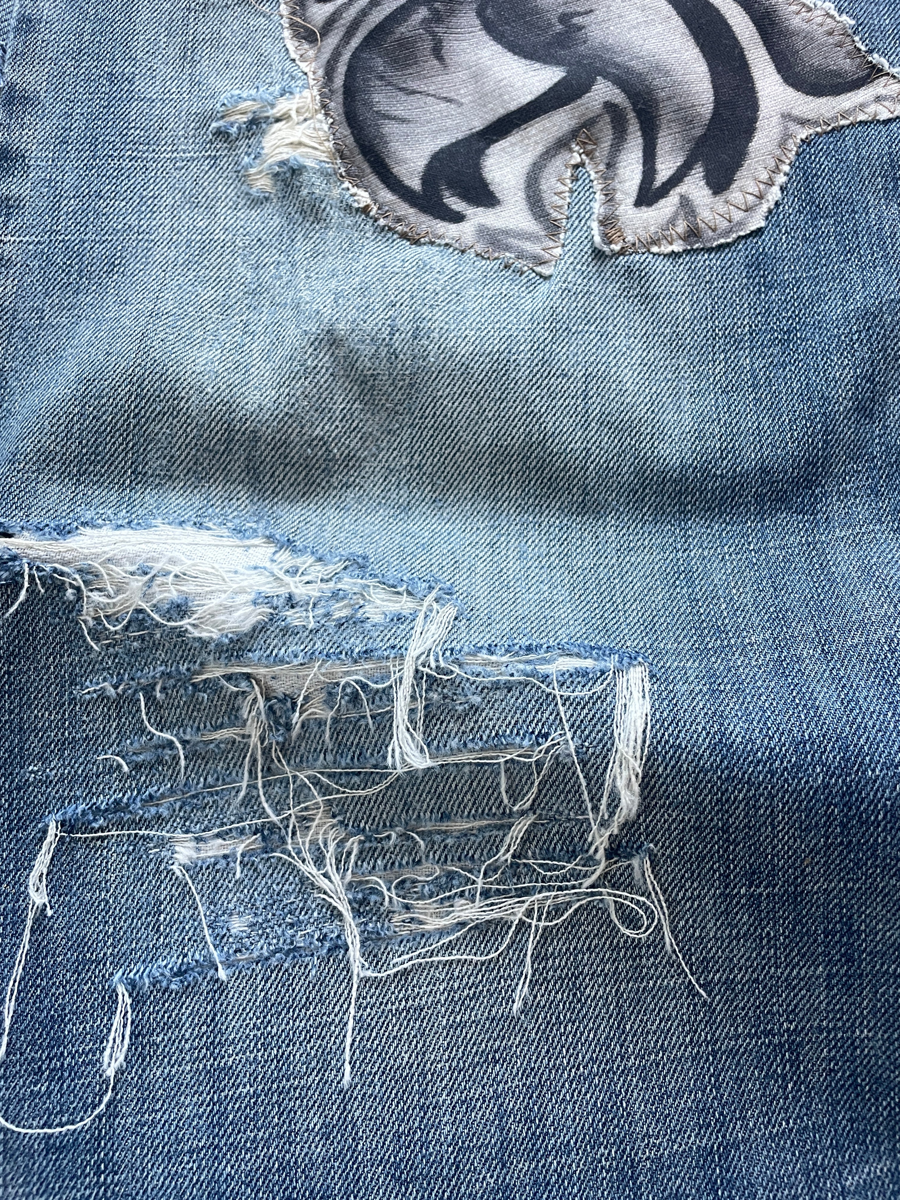 Patched graffiti distressed wide jeans