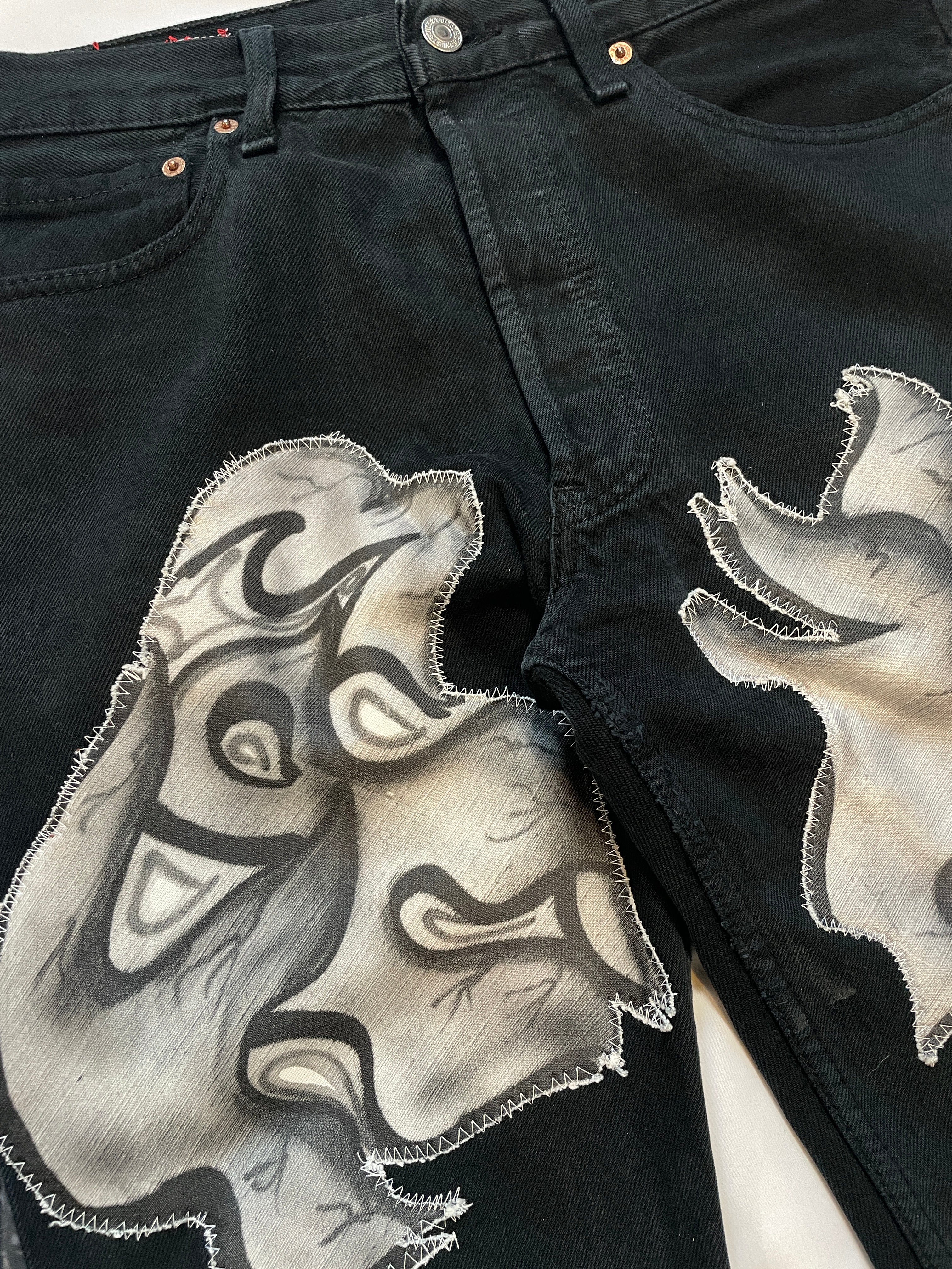 Python graffiti flare jeans